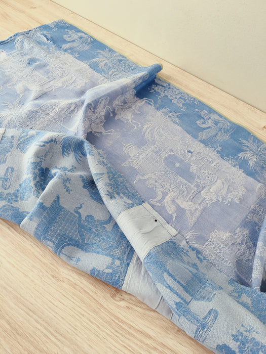 Blue faded ticking with dancer, buildings and soldiers on horseback. Spain c.1950 - 50×135 cm