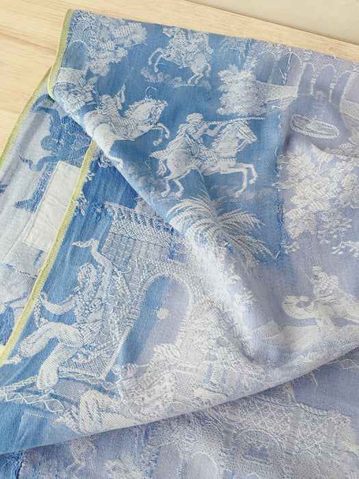 Blue faded ticking with dancer, buildings and soldiers on horseback. Spain c.1950 - 50×135 cm