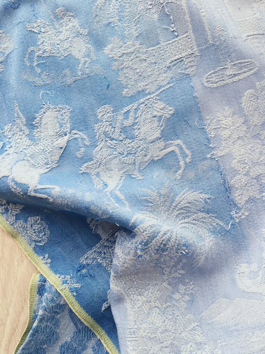 Blue faded ticking with dancer, buildings and soldiers on horseback. Spain c.1950 - 50×135 cm