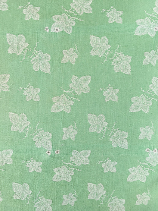Green ticking with vine leaves. Spain c.1940 - 48×80 cm