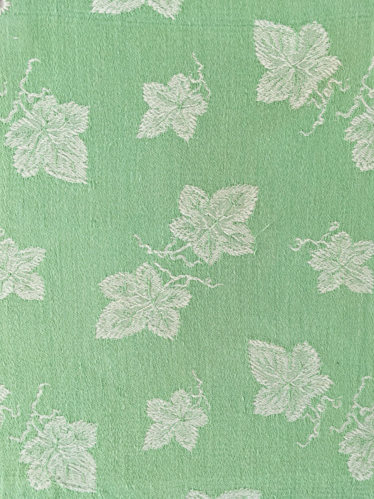 Green ticking with vine leaves. Spain c.1940 - 48×80 cm