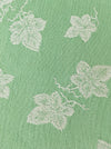 Green ticking with vine leaves. Spain c.1940 - 48×80 cm