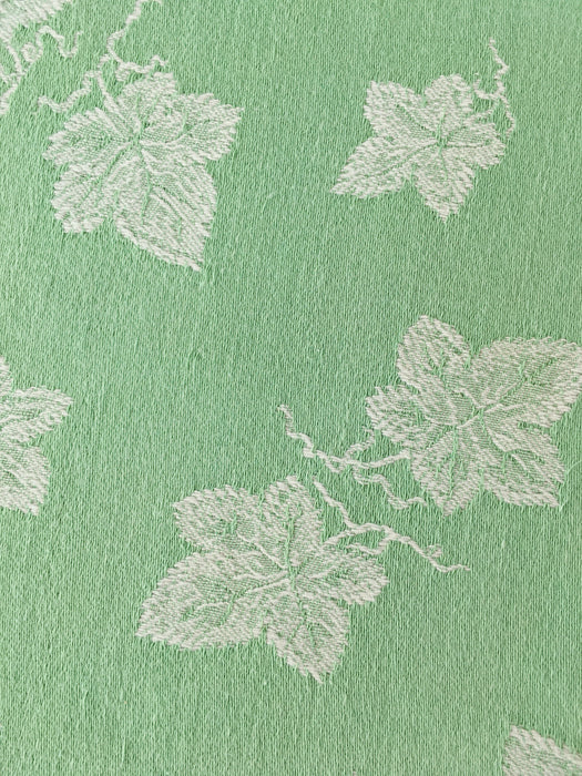 Green ticking with vine leaves. Spain c.1940 - 48×80 cm