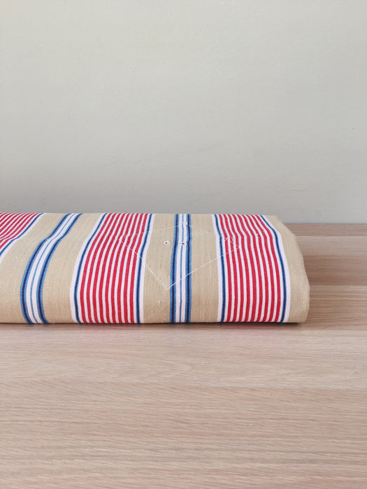 Ticking in beige, blue and red stripes. Spain c.1950 - 80×146 cm