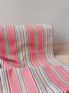 Ticking in pink, taupe, red, blue and yellow stripes. Spain c.1950 - 134×156 cm 