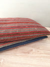 Cushions in wool gray, orange, red stripes. Sweden c.1900