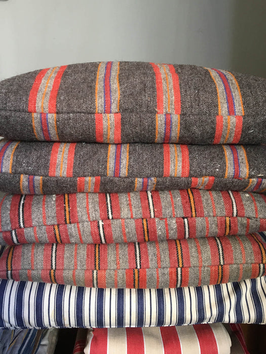 Cushions in wool gray, orange, red stripes. Sweden c.1900