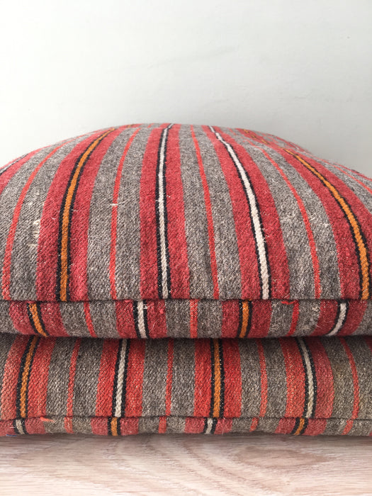Cushions in wool gray, orange, red stripes. Sweden c.1900