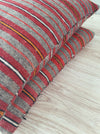 Cushions in wool gray, orange, red stripes. Sweden c.1900