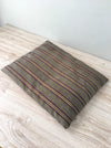 Cushion in stripes gray, brown, red, and yellow. Sweden c.1900