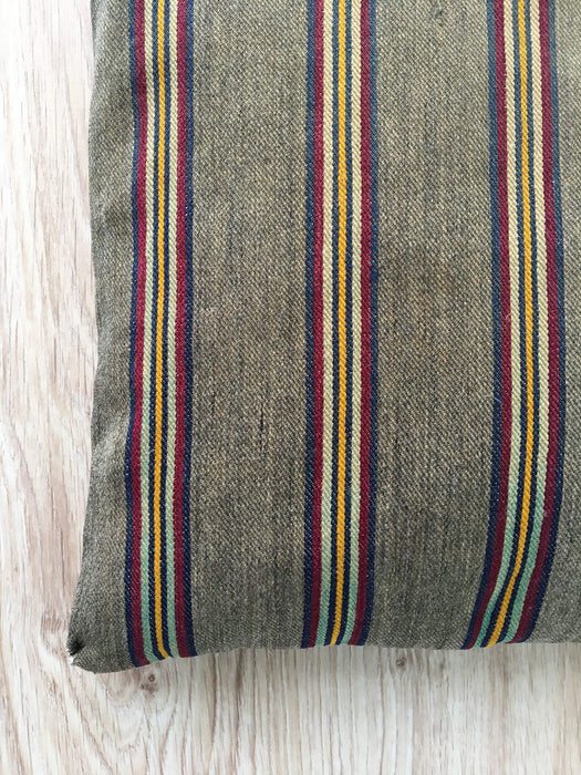 Cushion in stripes gray, brown, red, and yellow. Sweden c.1900