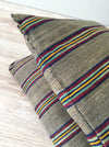 Cushion in stripes gray, brown, red, and yellow. Sweden c.1900