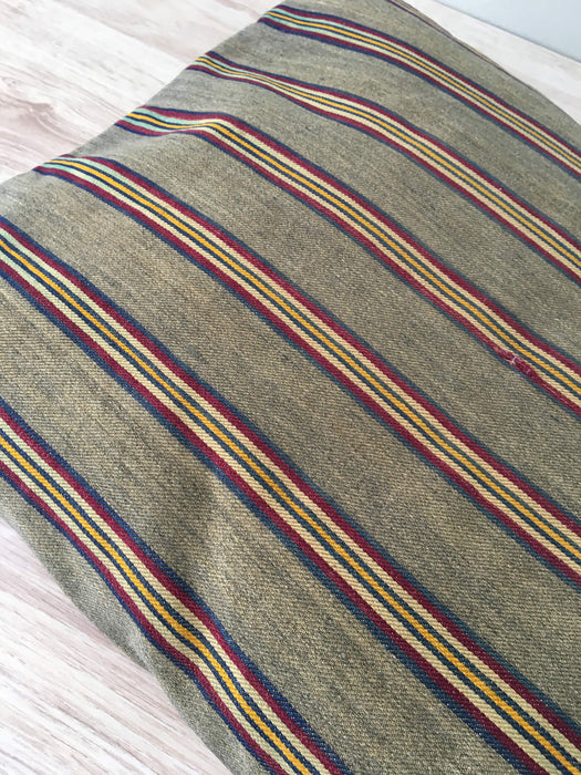 Cushion in stripes gray, brown, red, and yellow. Sweden c.1900