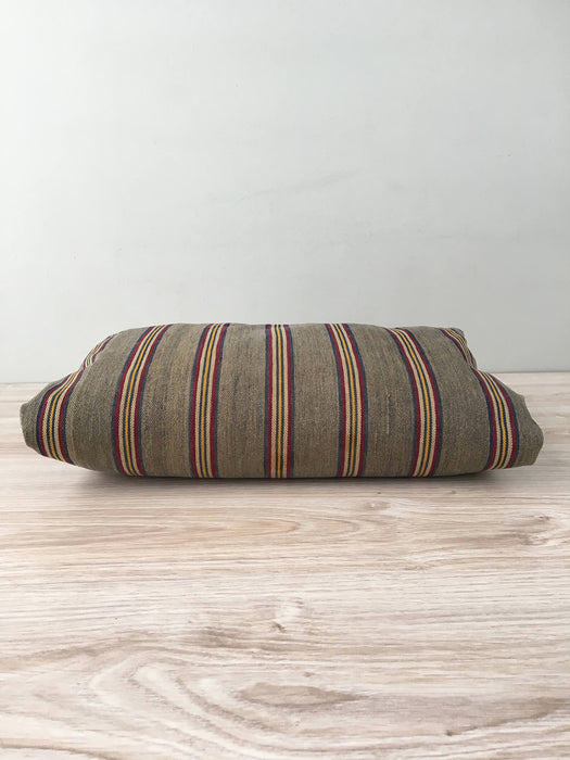 Cushion in stripes gray, brown, red, and yellow. Sweden c.1900