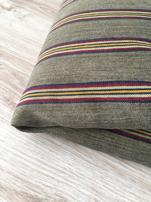 Cushion in stripes gray, brown, red, and yellow. Sweden c.1900