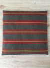 Cushion in pink, brown, and gray stripes. Wool. Sweden c.1900