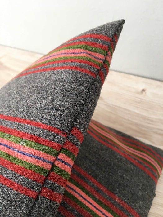 Cushion in pink, brown, and gray stripes. Wool. Sweden c.1900