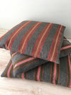 Cushion in pink, green, and gray stripes. Wool. Sweden c.1900