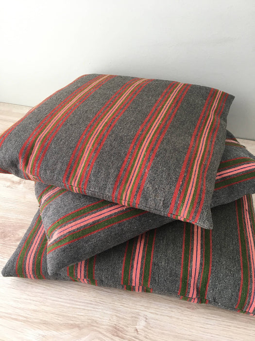 Cushion in pink, green, and gray stripes. Wool. Sweden c.1900
