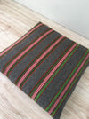 Cushion in pink, green, and gray stripes. Wool. Sweden c.1900
