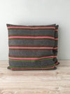 Cushion in pink, green, and gray stripes. Wool. Sweden c.1900