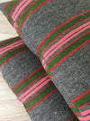 Cushion in pink, green, and gray stripes. Wool. Sweden c.1900