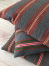 Cushion in pink, green, and gray stripes. Wool. Sweden c.1900