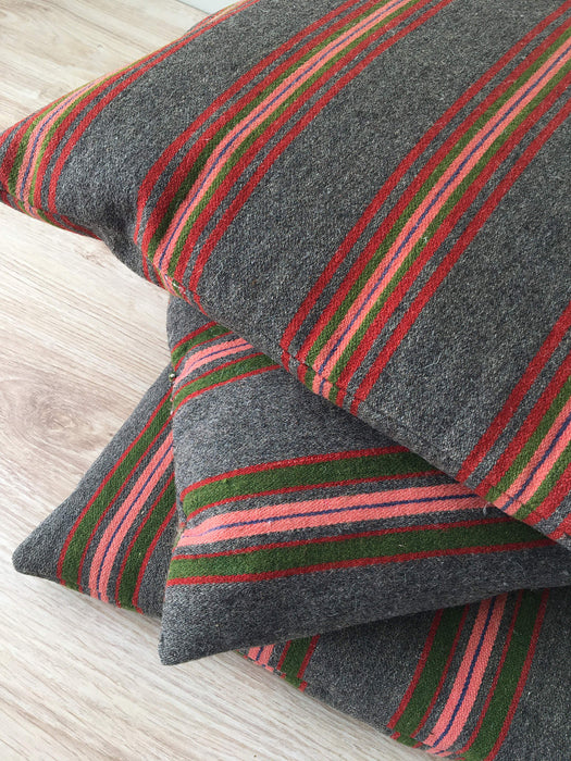Cushion in pink, green, and gray stripes. Wool. Sweden c.1900