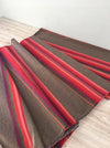Long panels that were once a Swedish bolster in brown and vibrant warm colors (red, pink, orange, …). c.1900