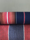 Swedish ticking in denim blue, orange, red, and thin white stripes. c.1940 - 94 cm × 3.3 meters