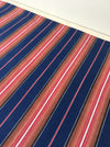 Swedish ticking in denim blue, orange, red, and thin white stripes. c.1940 - 94 cm × 3.3 meters