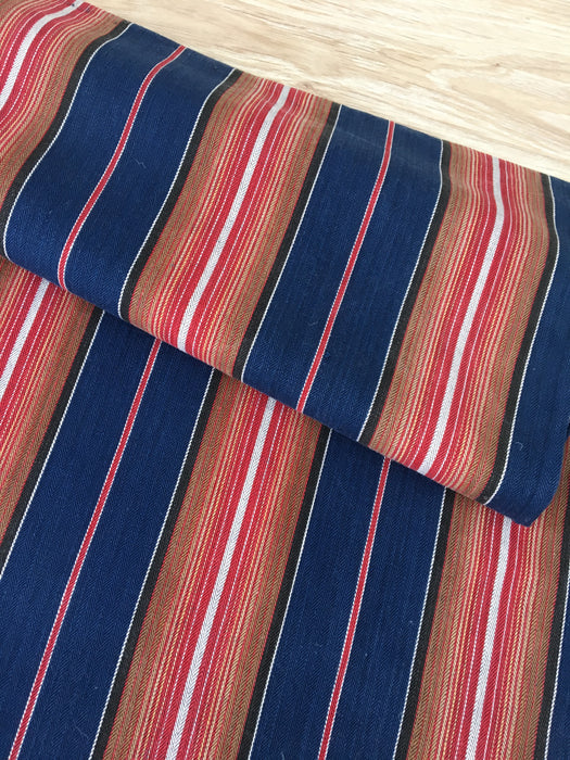 Swedish ticking in denim blue, orange, red, and thin white stripes. c.1940 - 94 cm × 3.3 meters