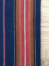 Swedish ticking in denim blue, orange, red, and thin white stripes. c.1940 - 94 cm × 3.3 meters